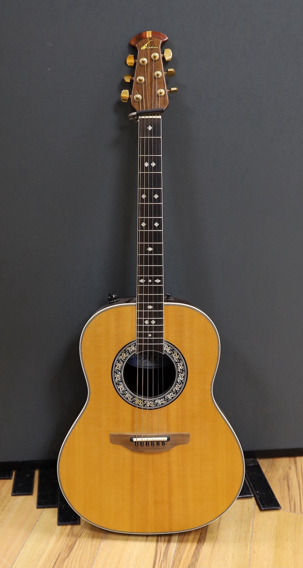 An Ovation acoustic guitar in case